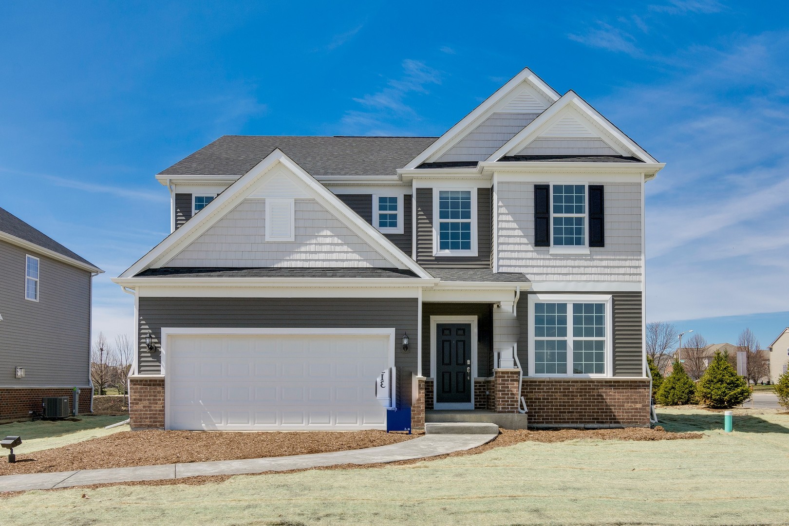 a front view of a house with a yard