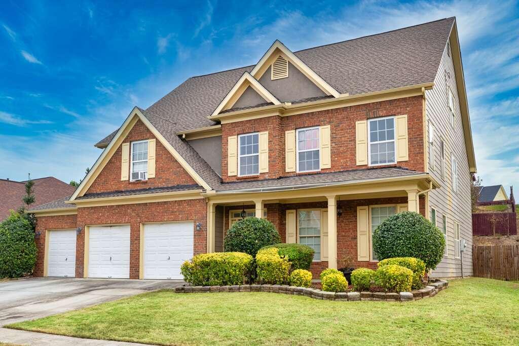 front view of a house with an yard