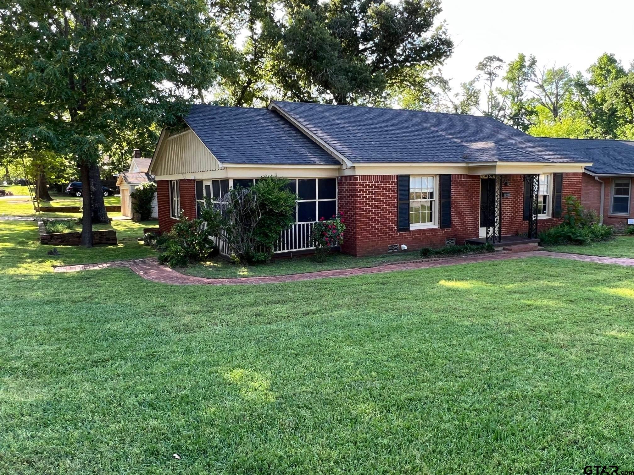 a view of a house with a yard