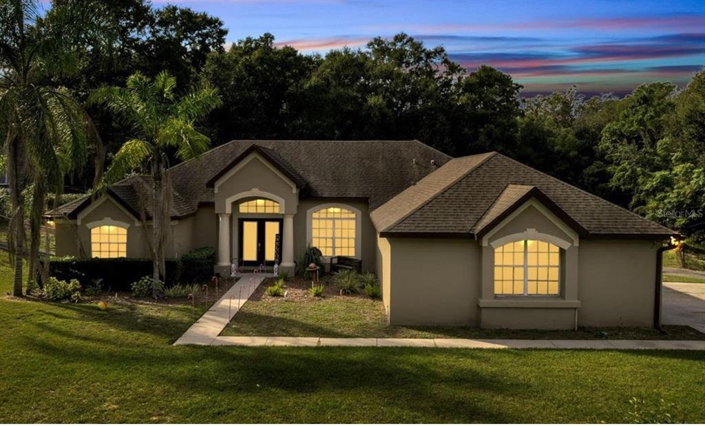 a front view of a house with a yard