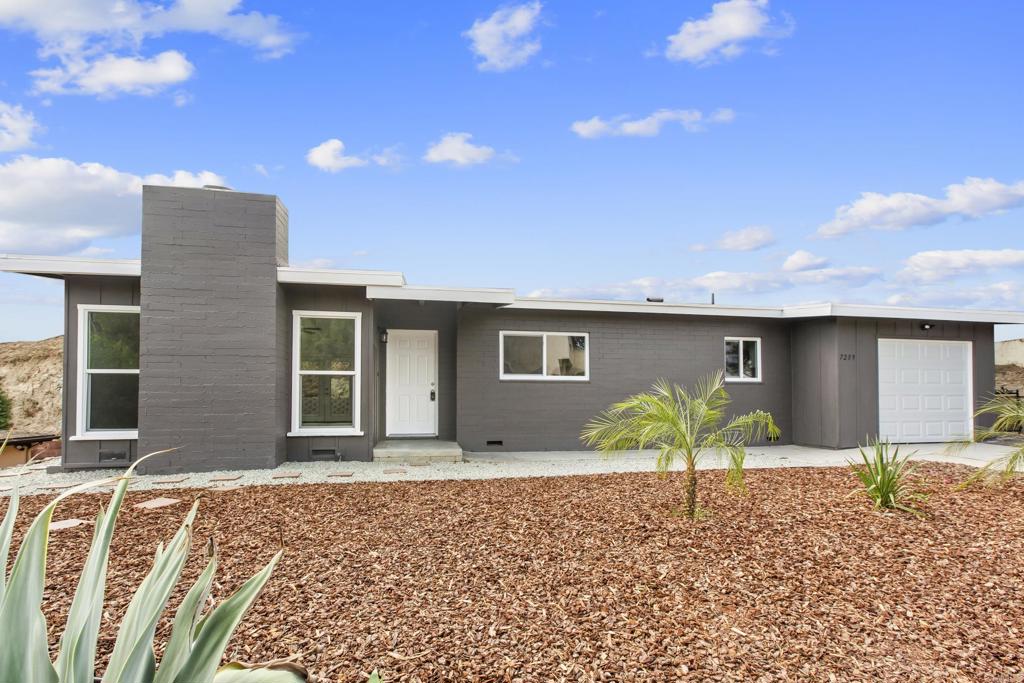 a house view with a backyard space