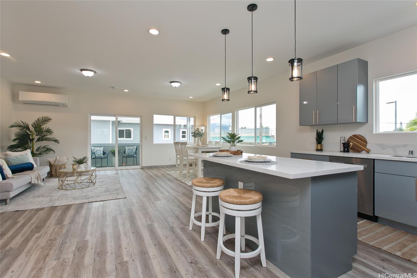 a kitchen with sink table and chairs