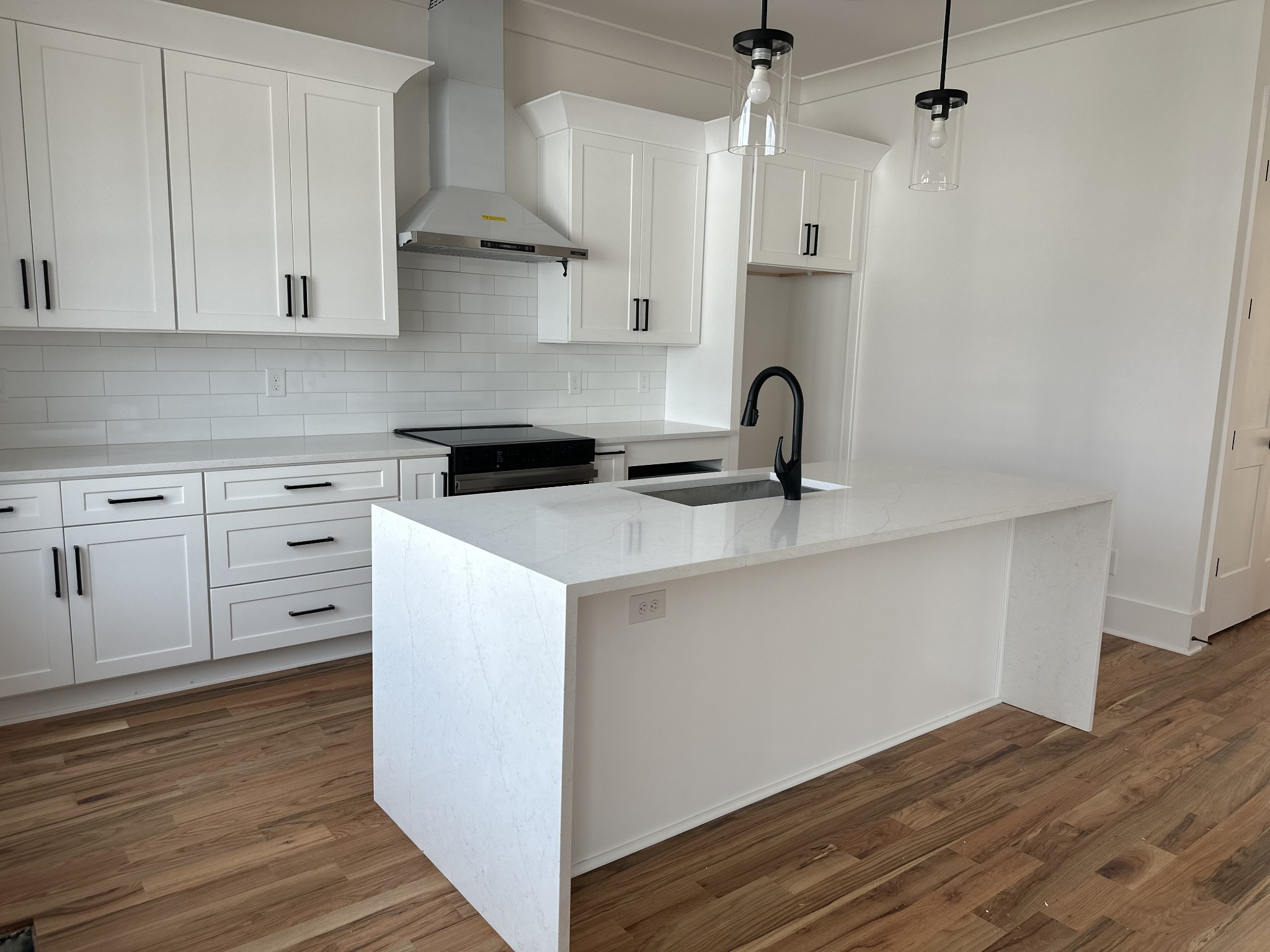 a kitchen with cabinets appliances and a counter space