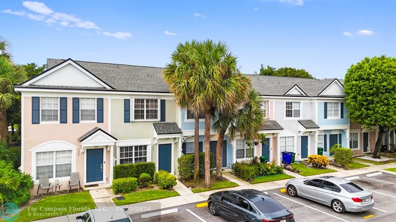 a front view of a residential houses with yard