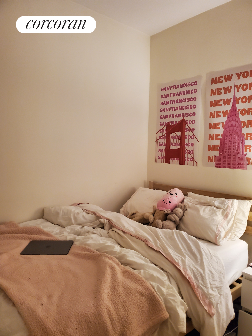 a bedroom with a bed and a wall painting