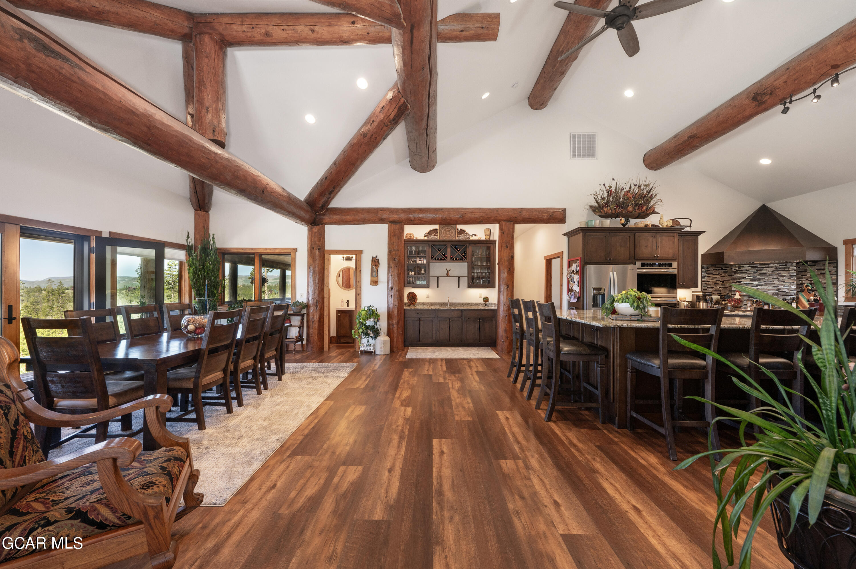 a view of a dining room with furniture window and wooden floor