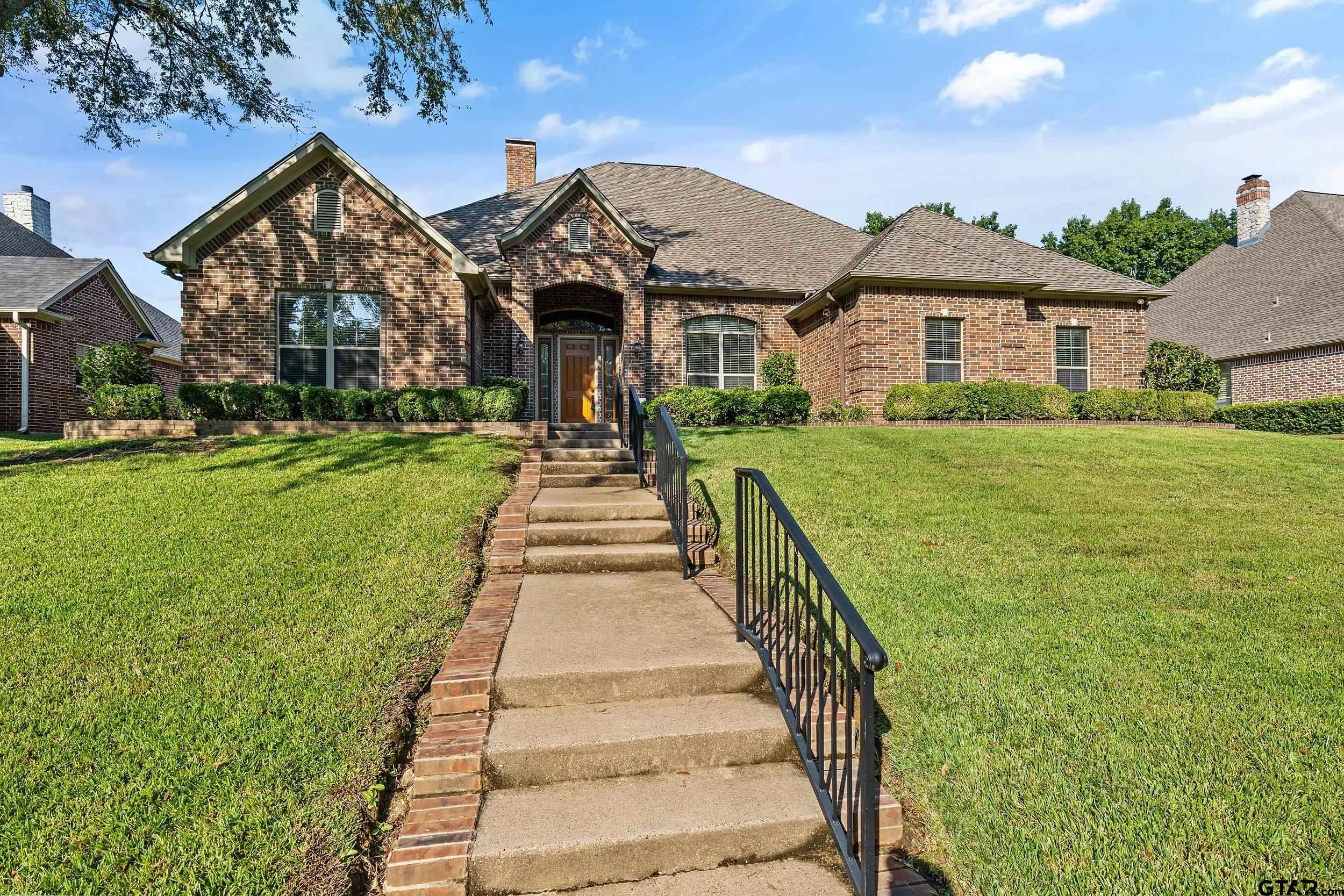 a front view of a house with yard