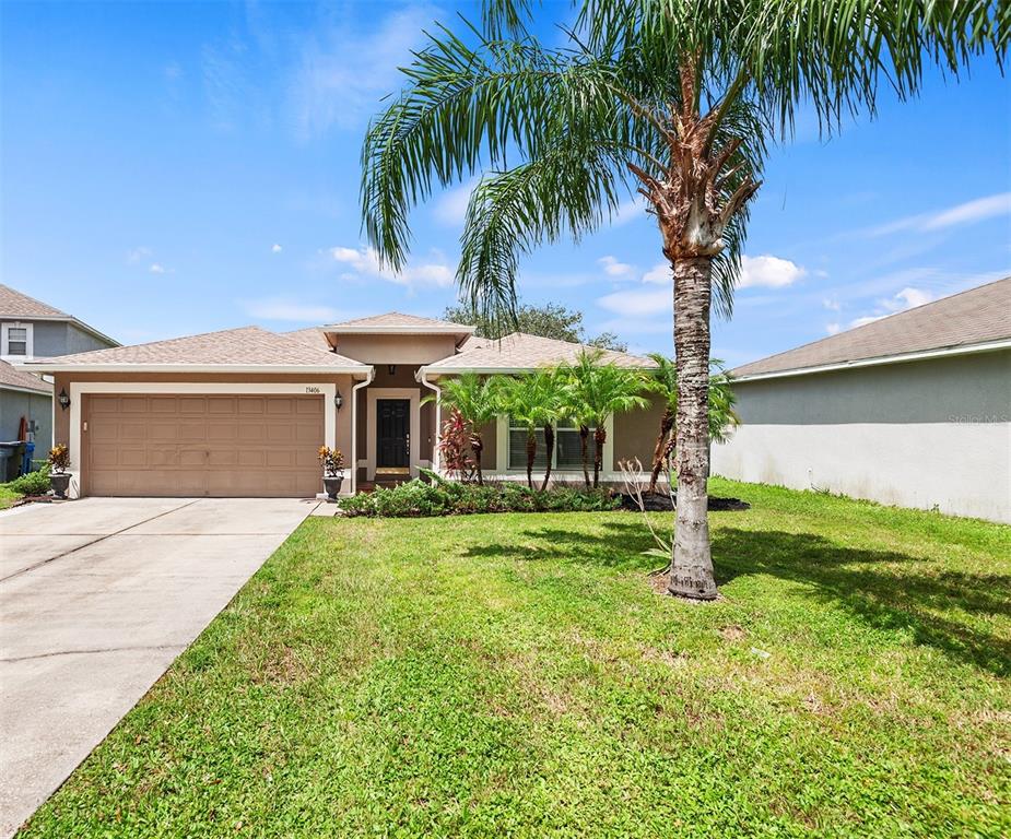 a front view of house with yard and entertaining space