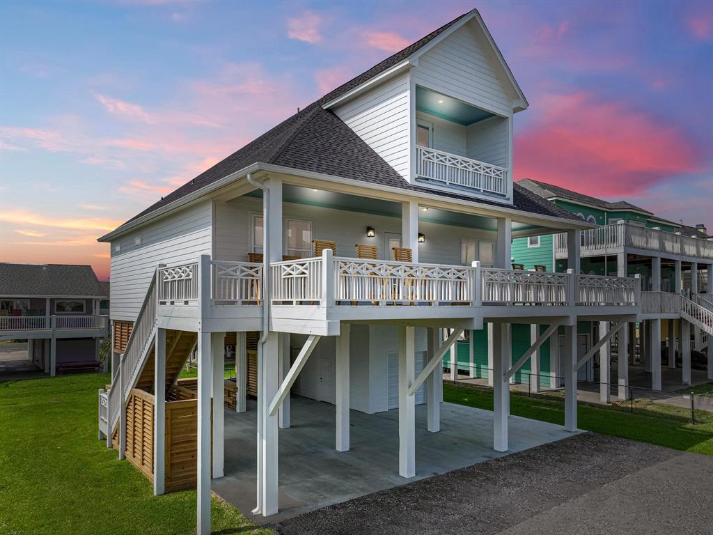 a front view of house with deck and outdoor seating