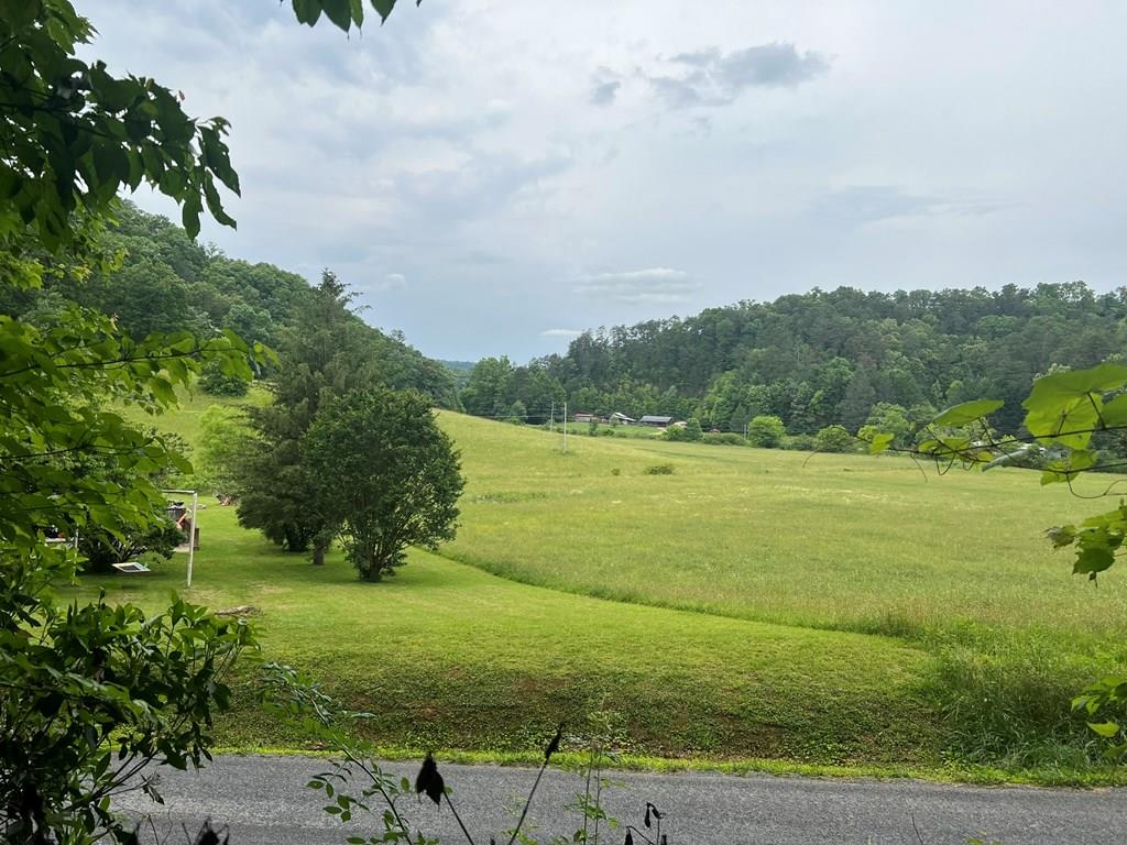 a view of a lake with a big yard