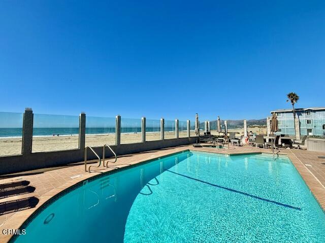 a view of a swimming pool with chairs