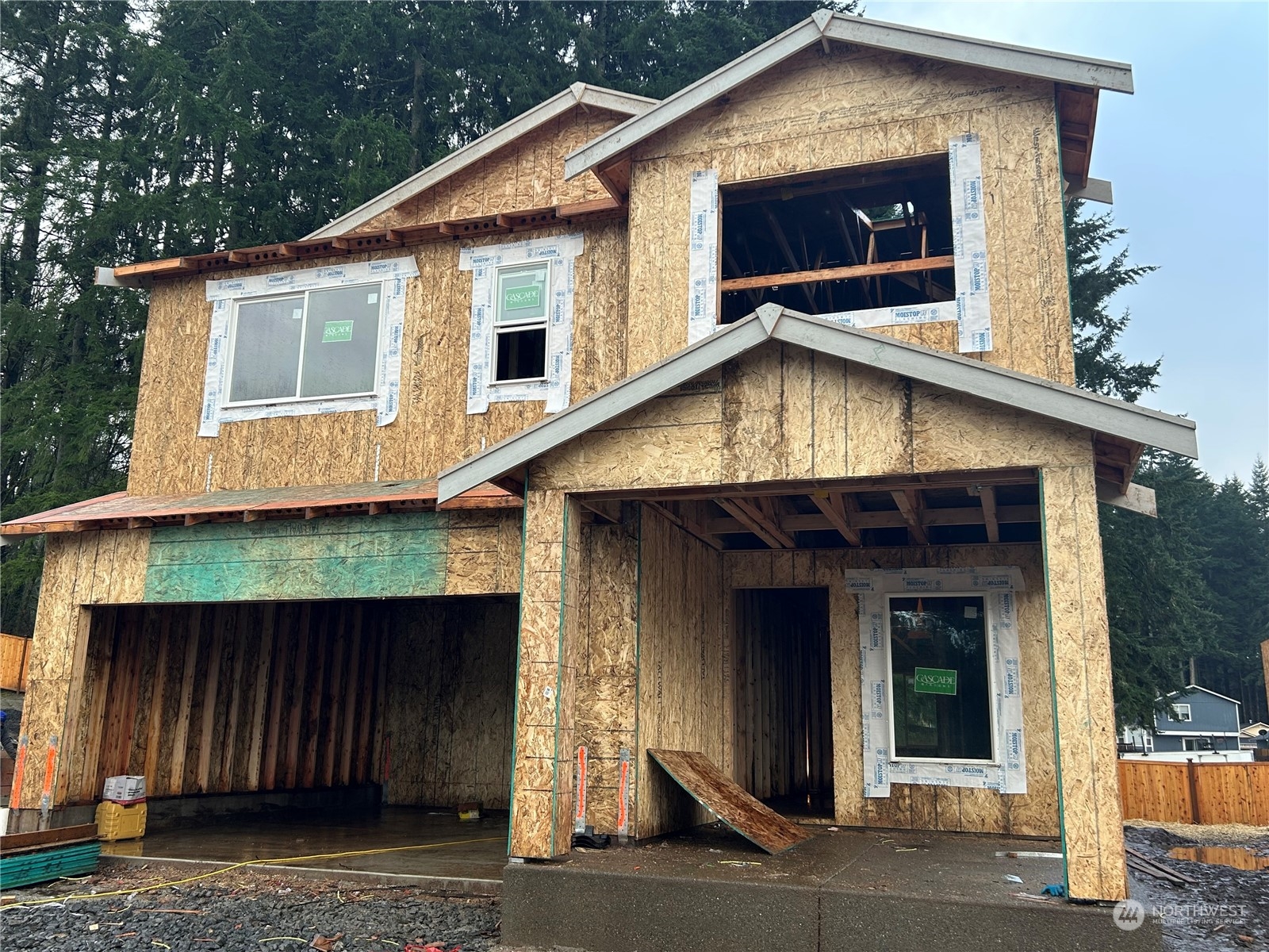 a front view of a house with garage