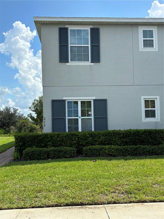 a view front of house with yard and green space