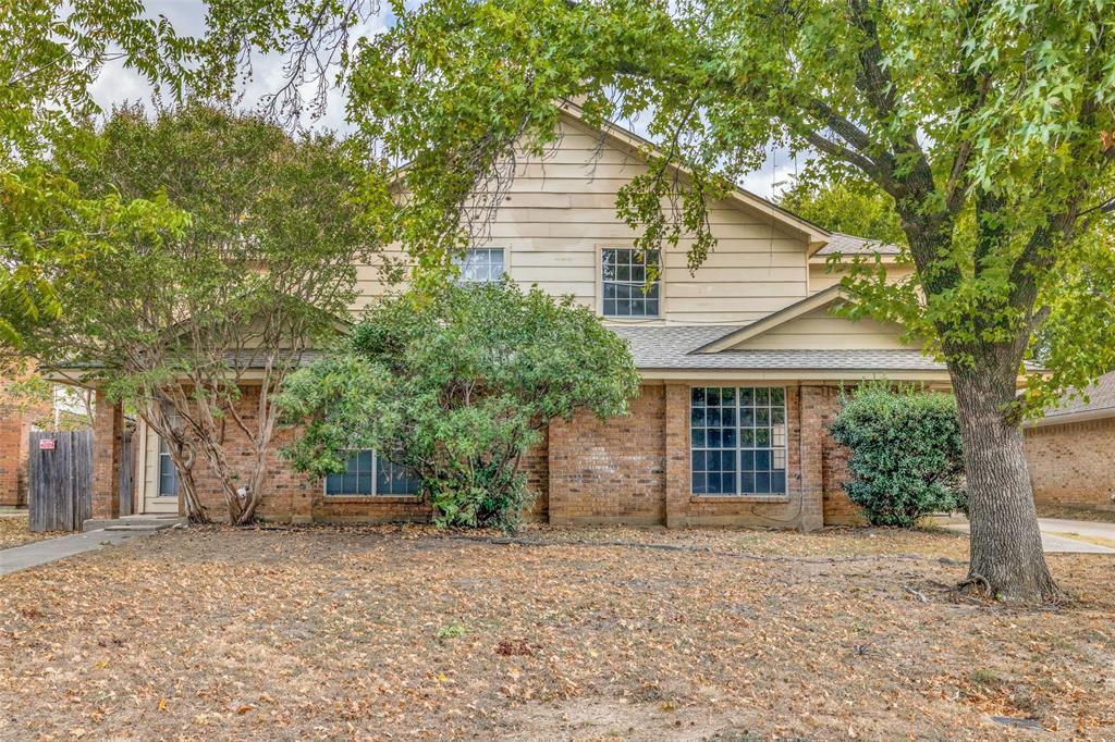 a house with a tree in front of it