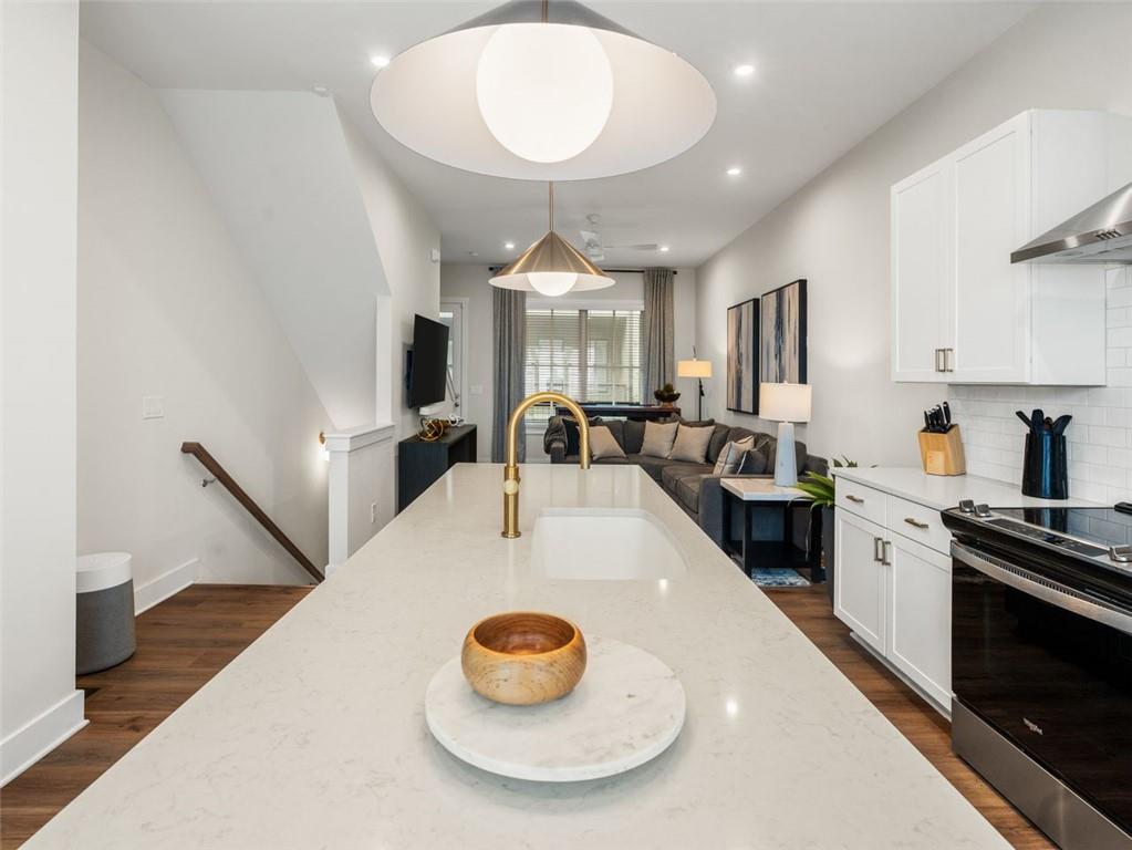 a large kitchen with a table and chairs