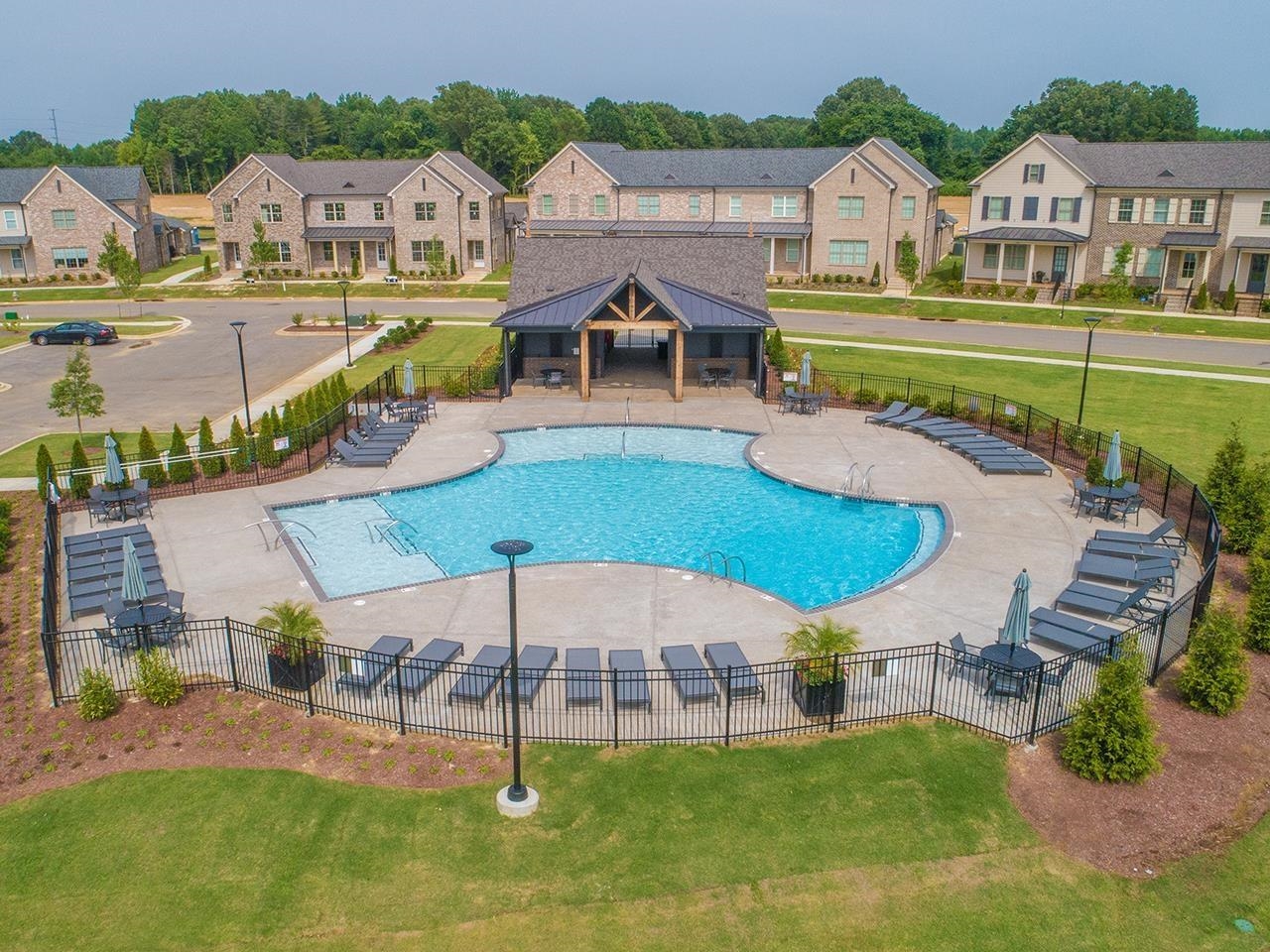 an aerial view of a house with swimming pool outdoor seating