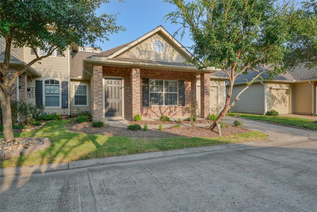 a front view of a house with a yard and porch