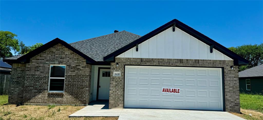 a front view of a house with garage