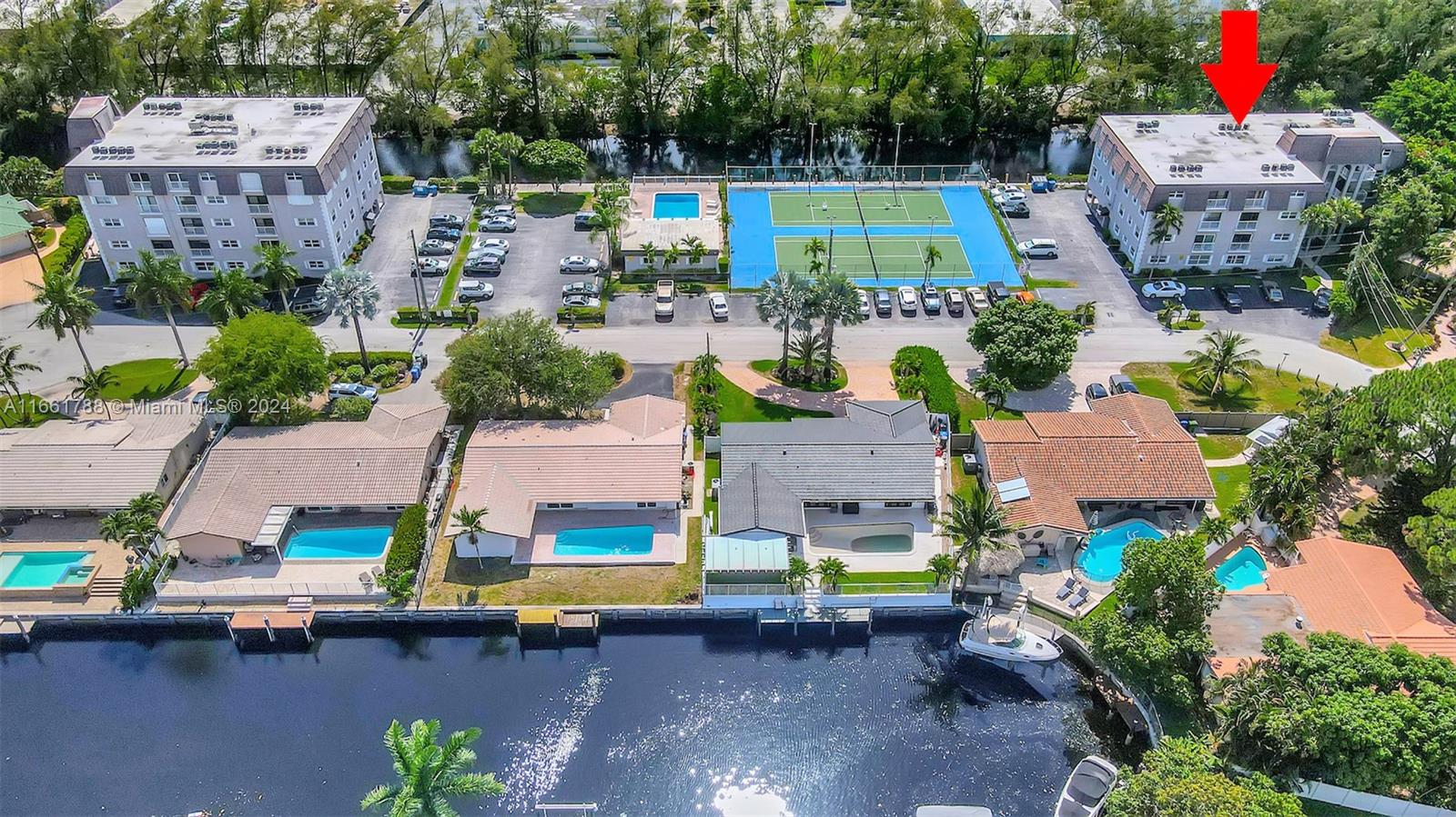 an aerial view of multiple houses with outdoor space