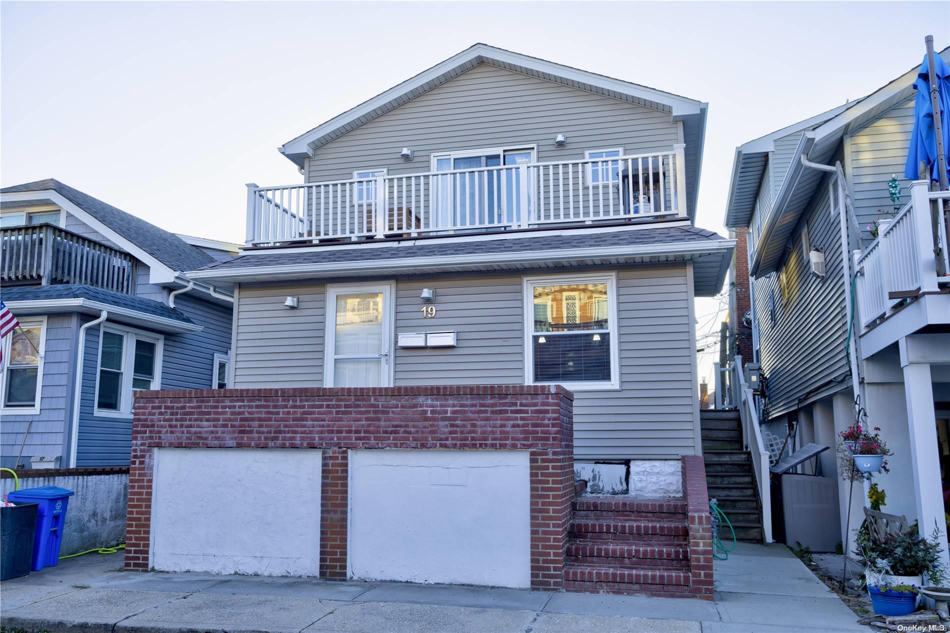 a front view of a house with a garage