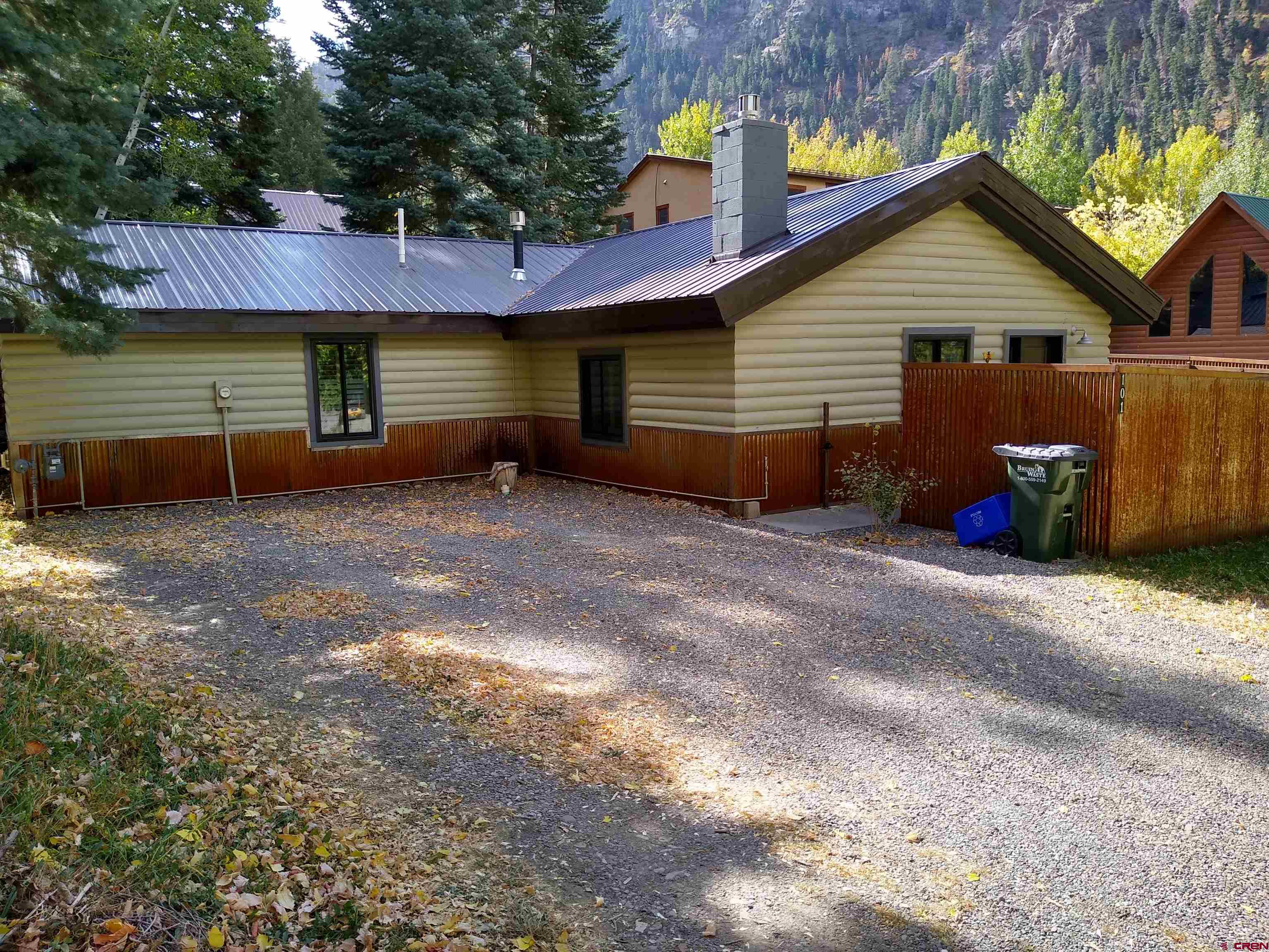 a front view of a house with a yard and a garage