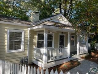 a view of a house with a small deck