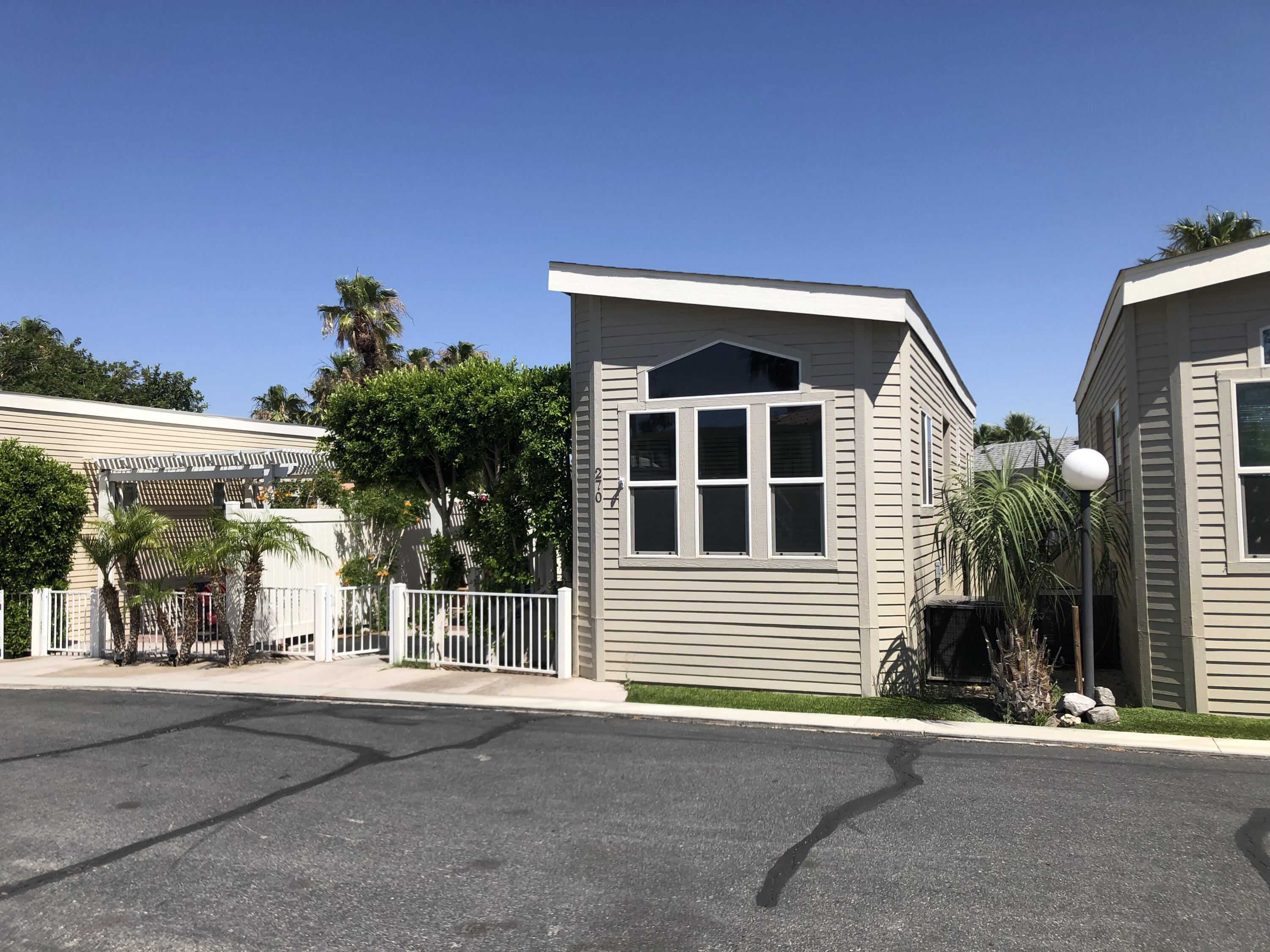 a view of a house with a street