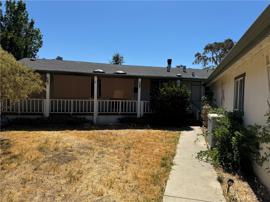 a view of house with wooden fence