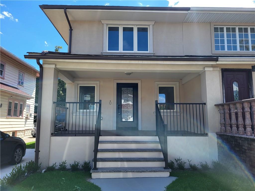 a front view of a house with a porch