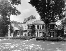 a front view of residential houses with yard