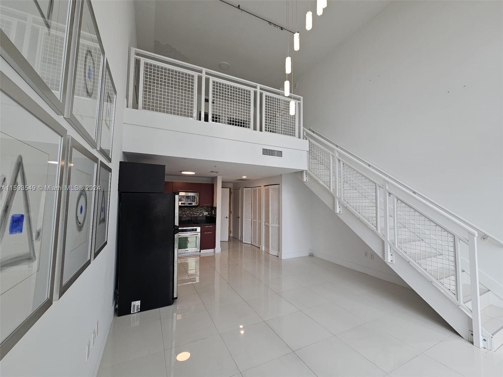 a view of a hallway with staircase