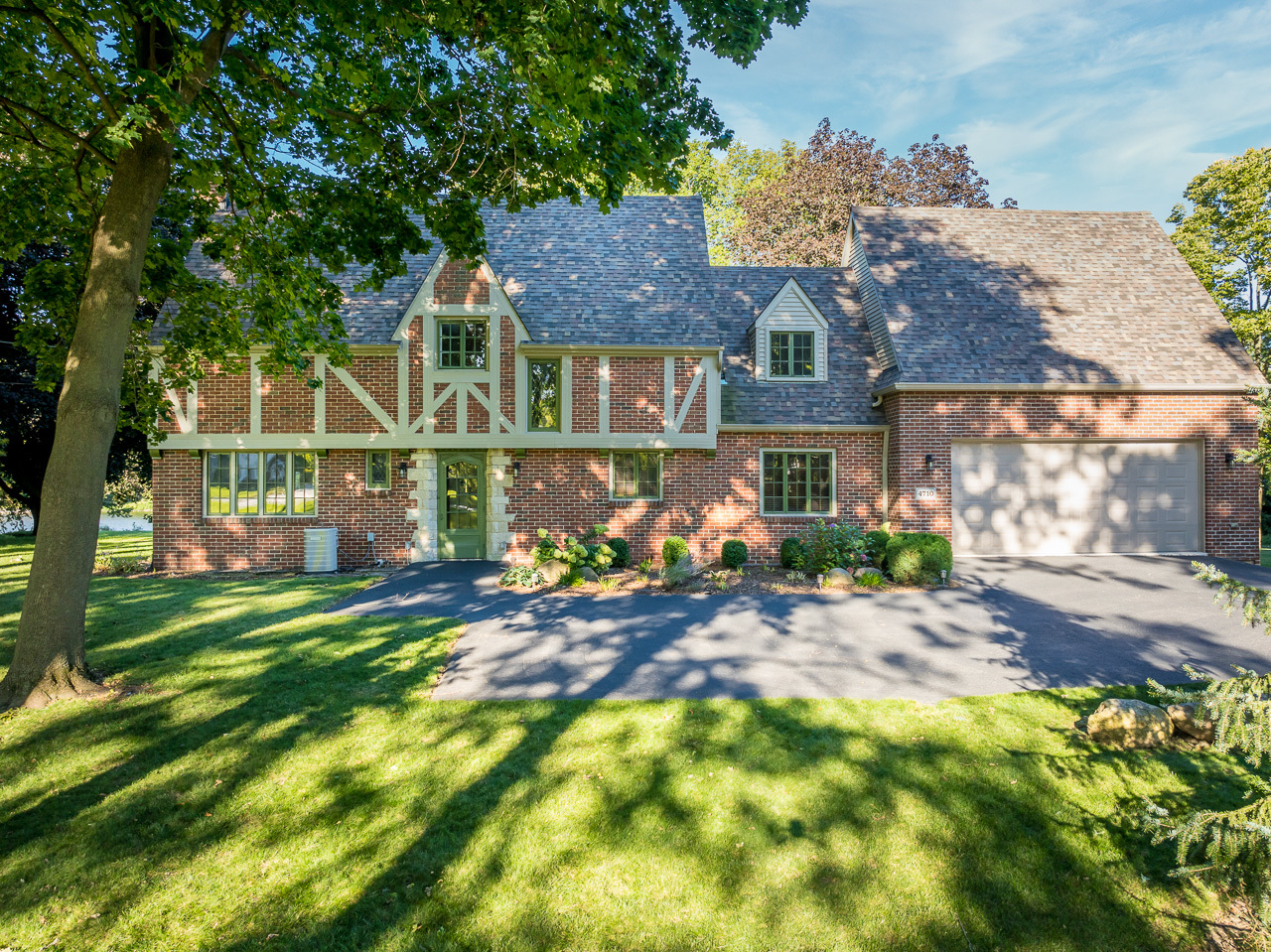 front view of a house with a big yard