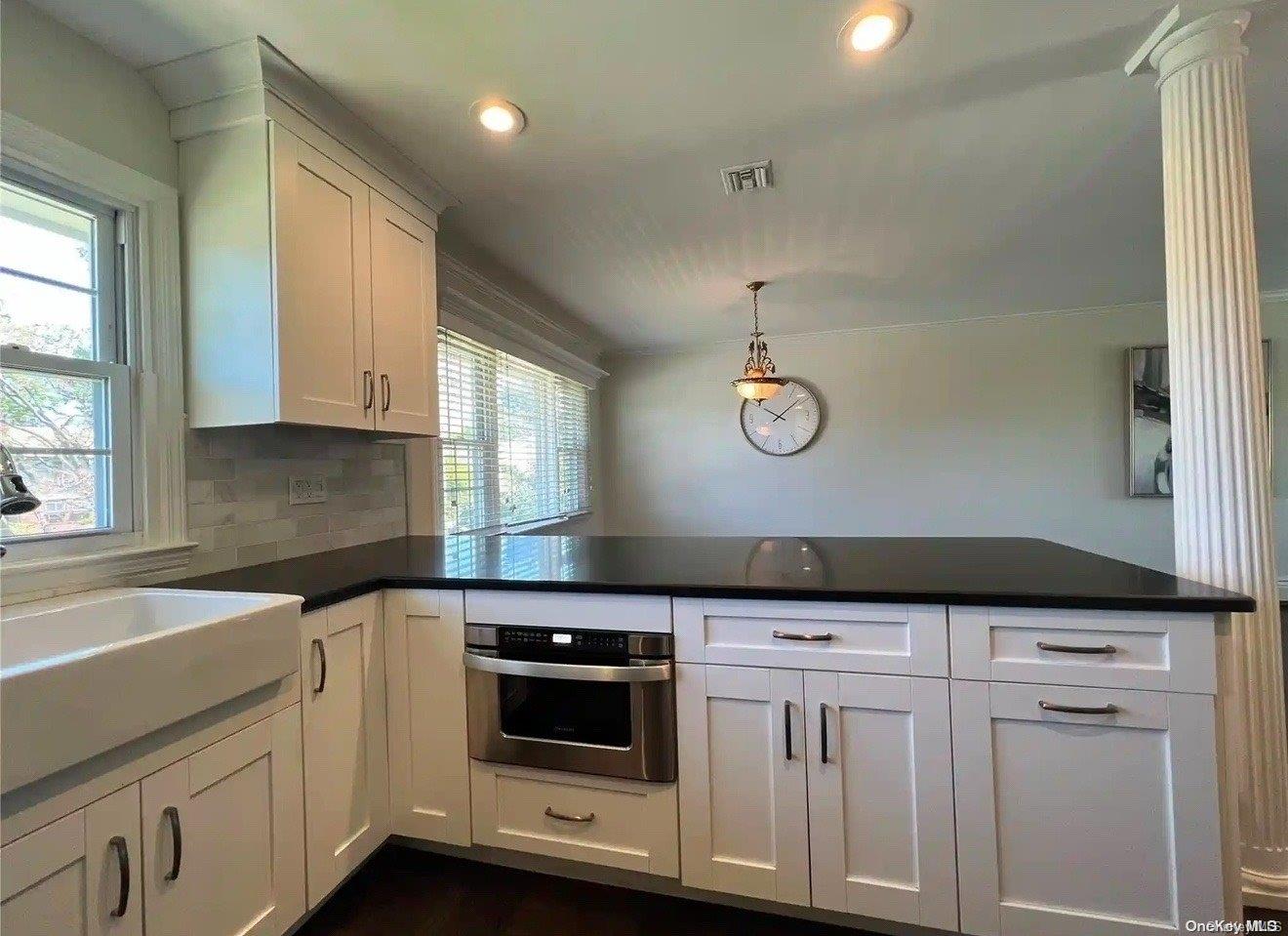 a kitchen with a sink and cabinets