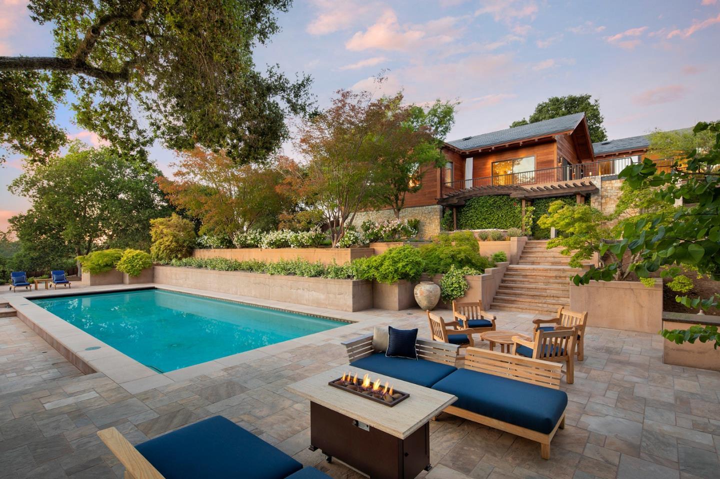 a view of a backyard with sitting area