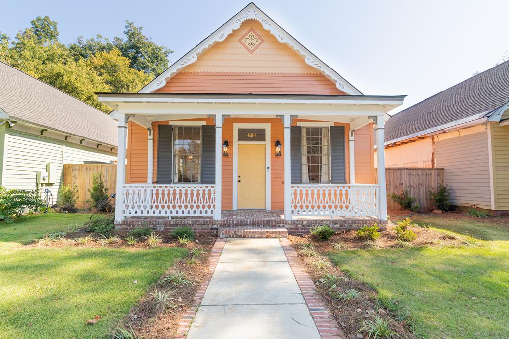 a front view of a house with garden