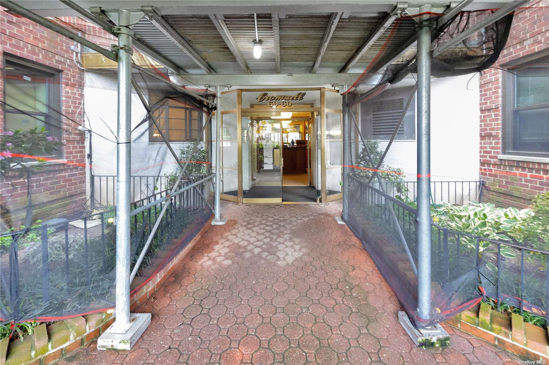 a view of a pathway of a house with a porch