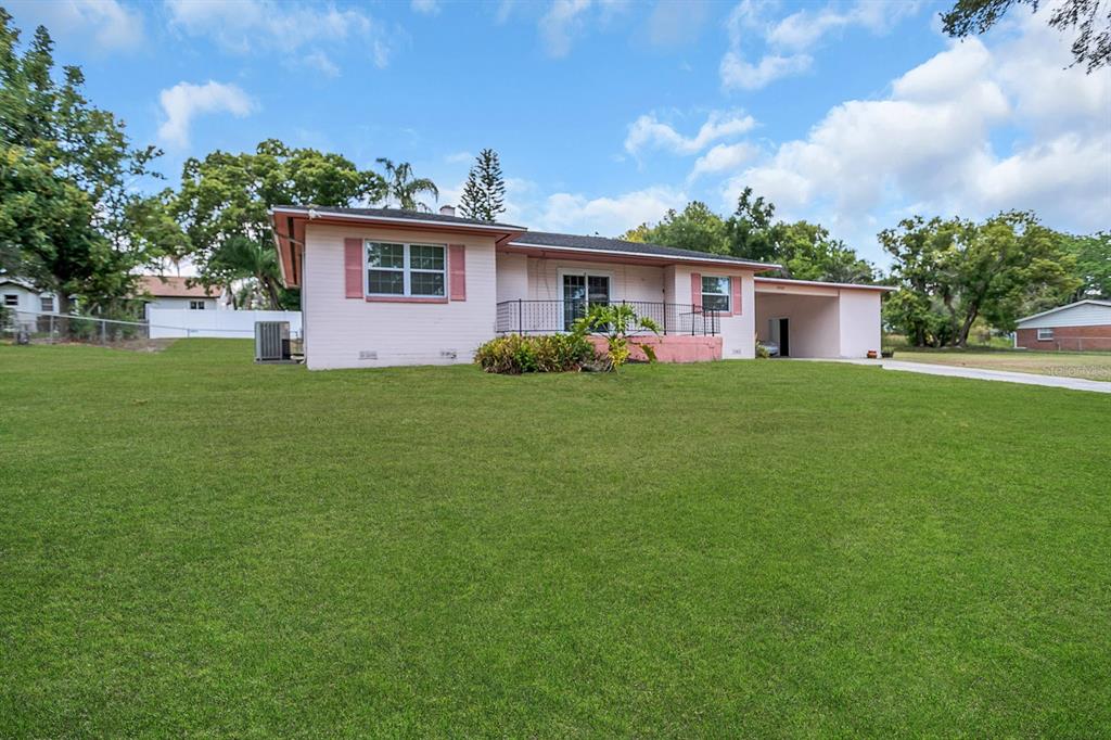 a view of a house with a back yard