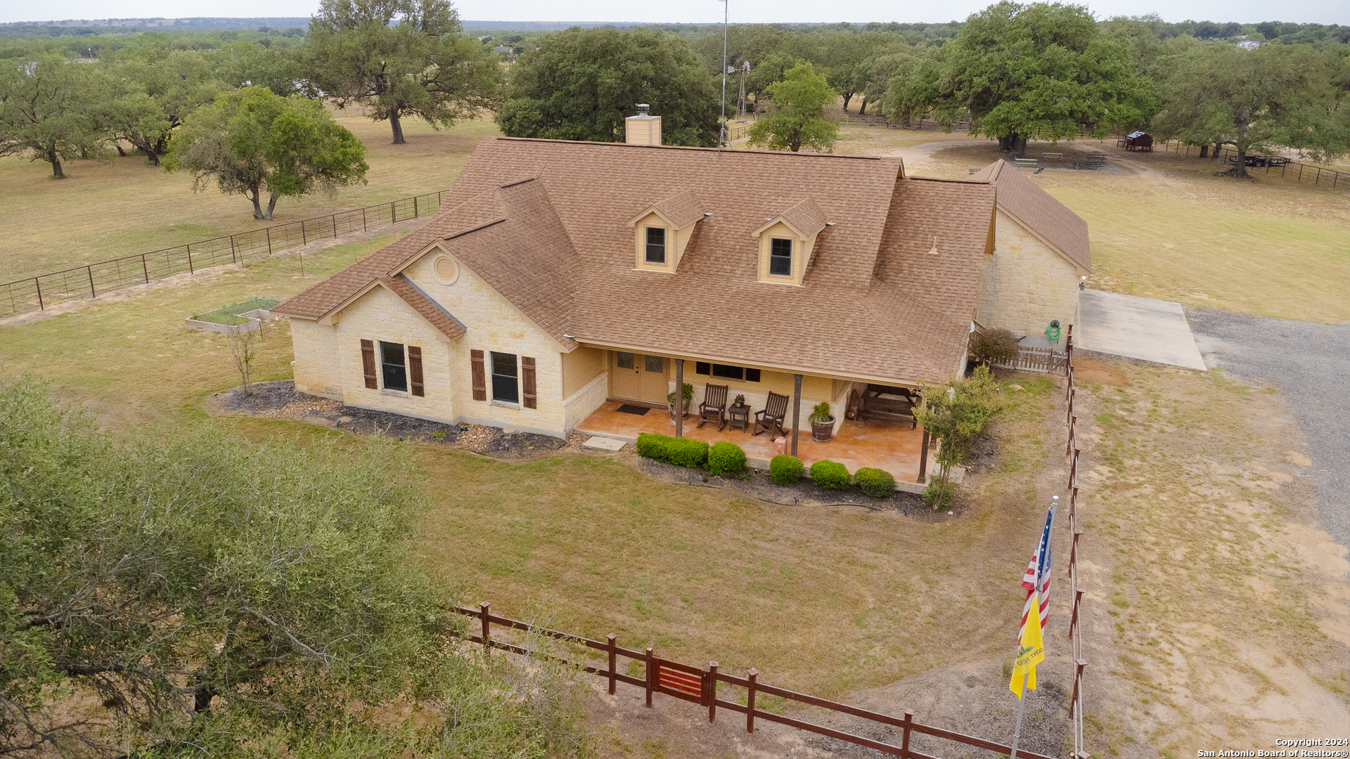 a aerial view of a house with a yard