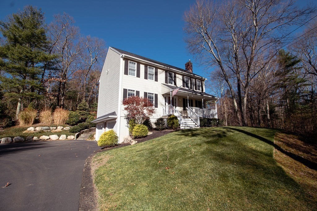 a view of a house with backyard porch and sitting area