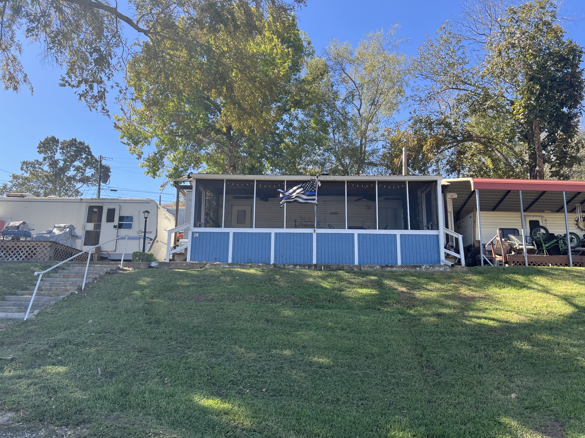 a view of a house with backyard and porch