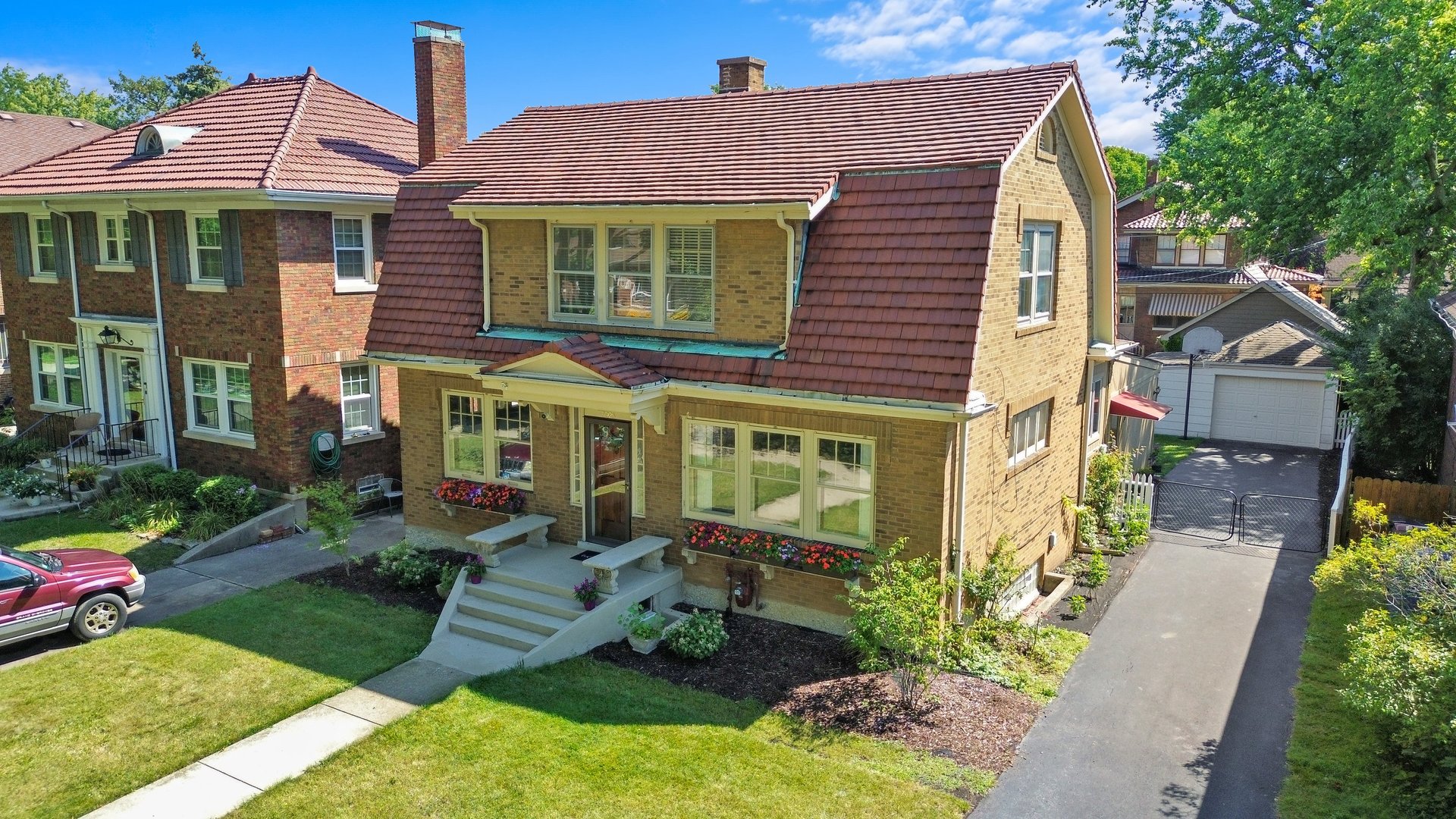 a front view of a house with garden