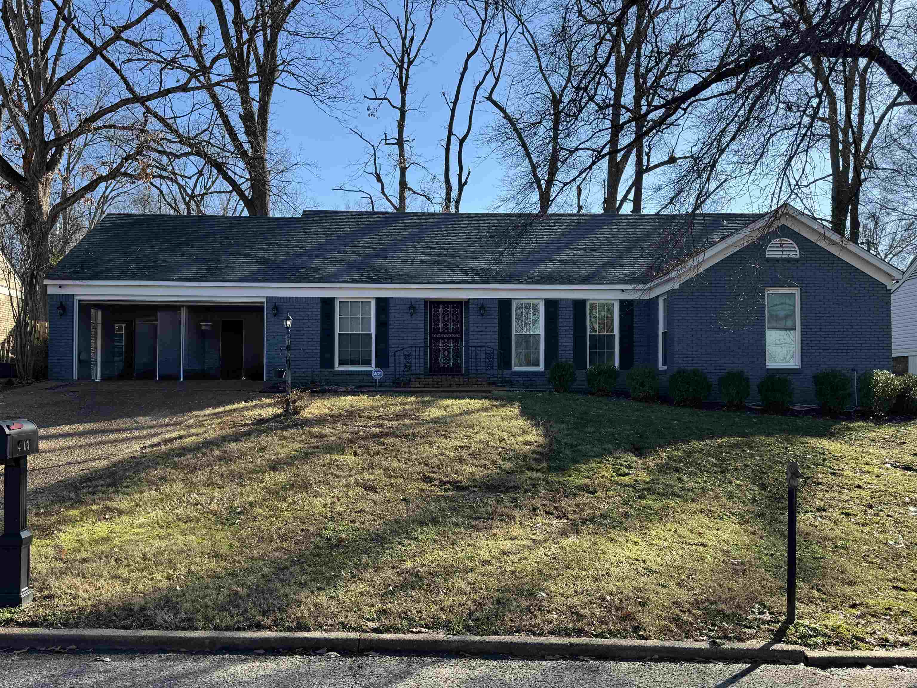 front view of a house with a yard