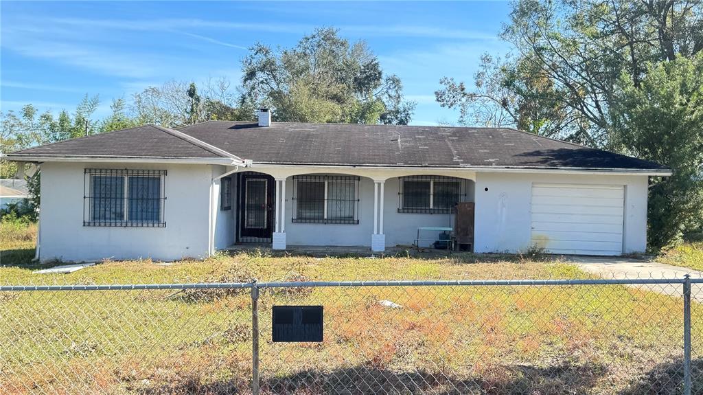 a front view of a house with yard