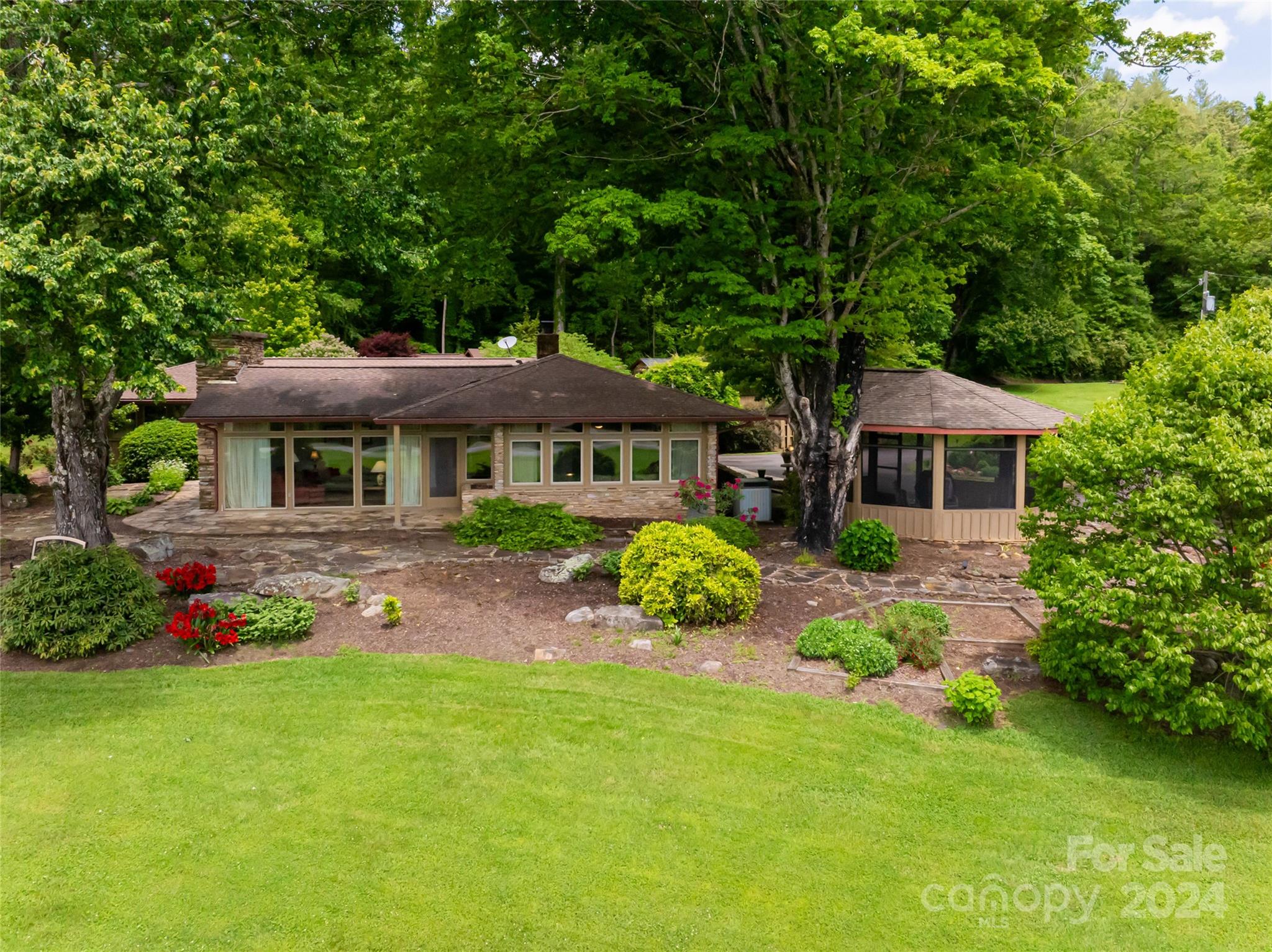 a front view of a house with garden