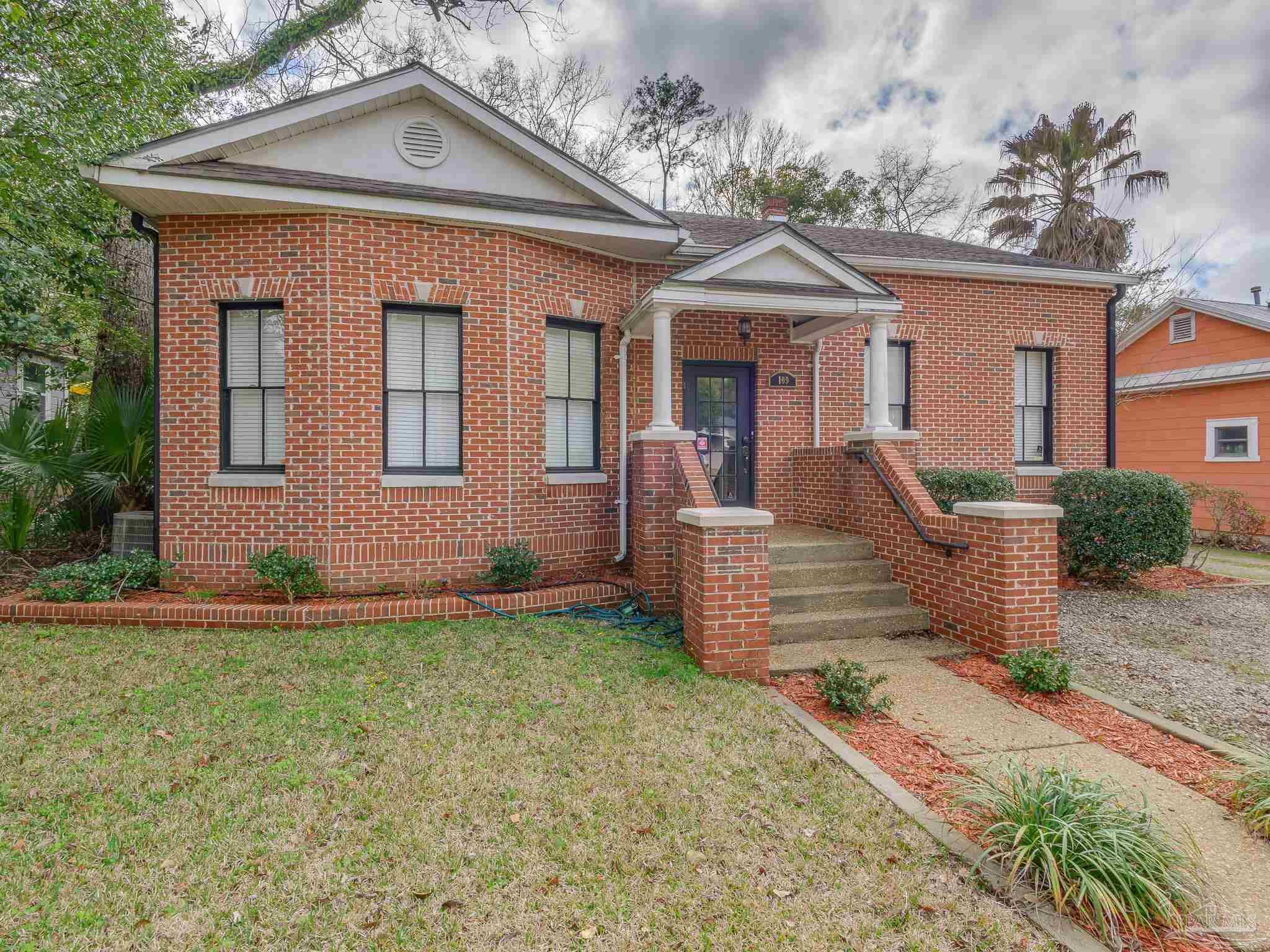 front view of a house with a yard