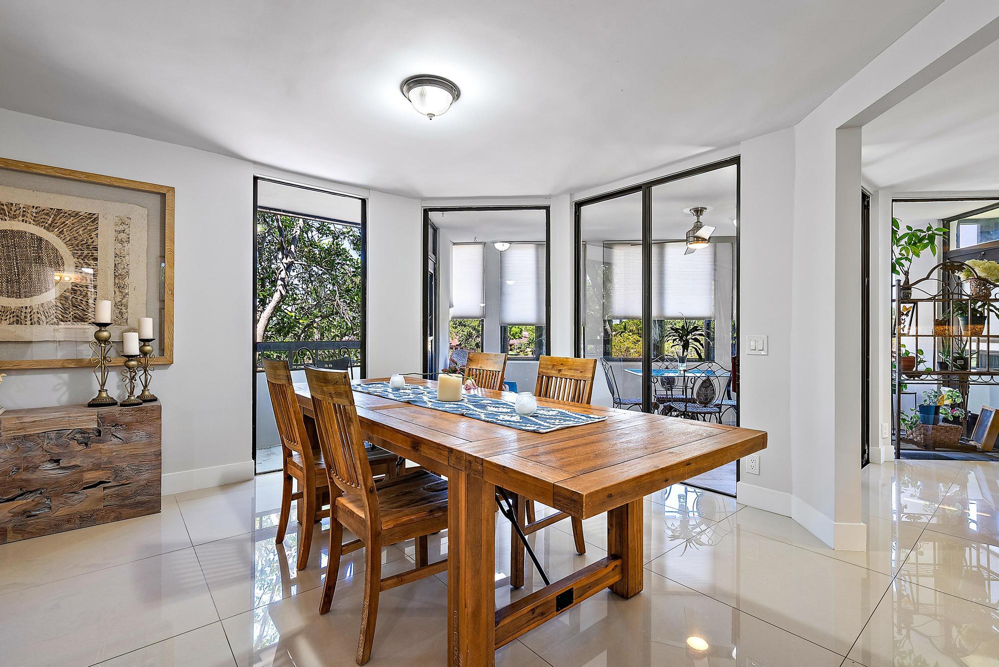 a view of a dining room with furniture window and outside view