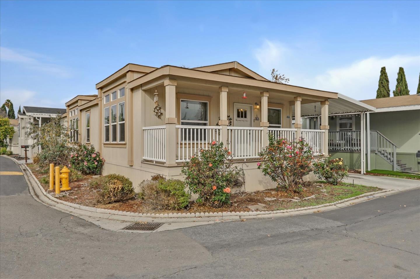 a front view of a house with a garden