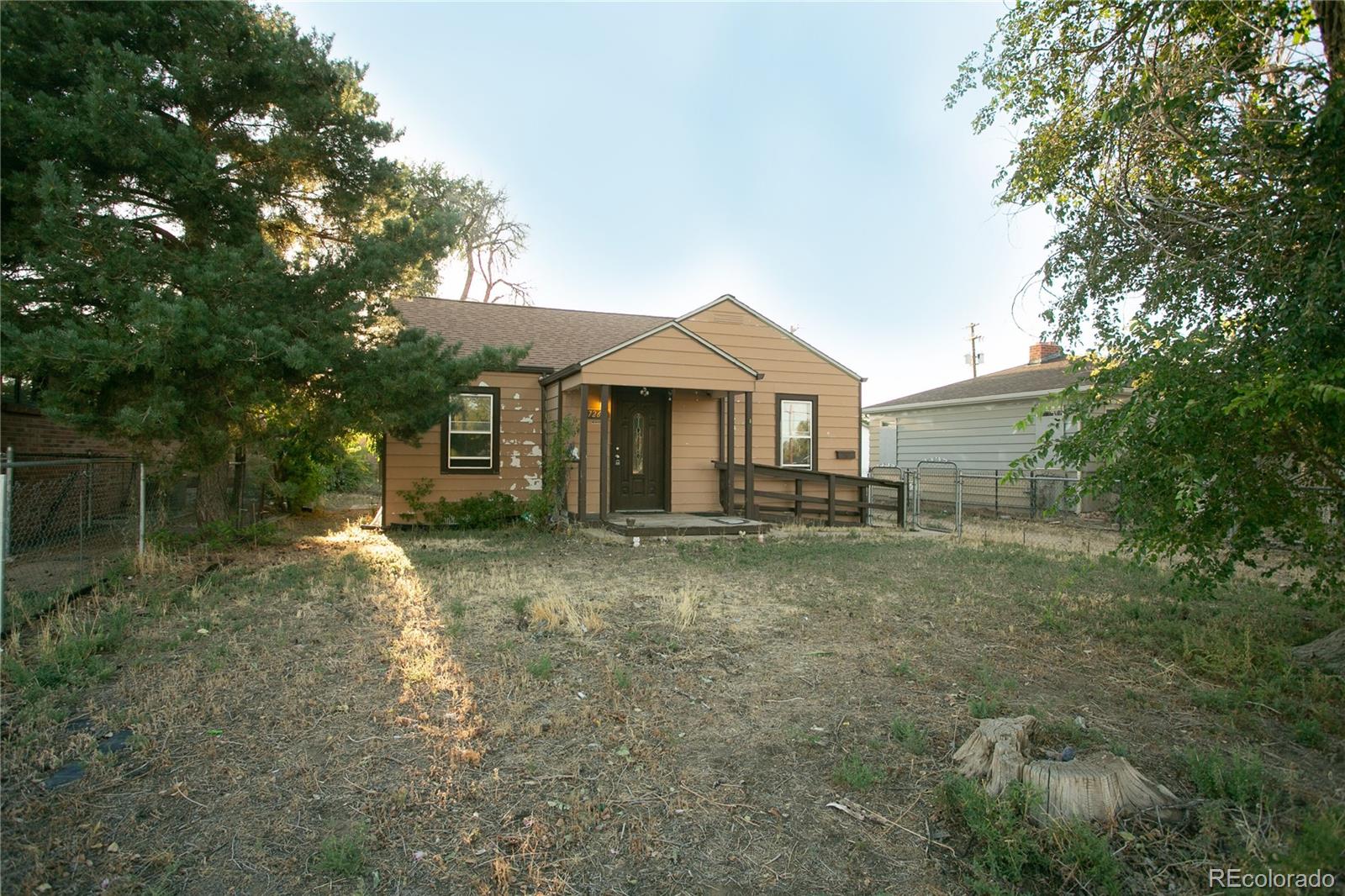 front view of a house with a yard