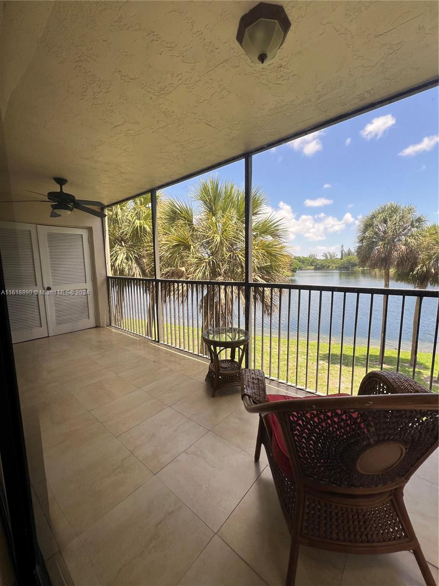 a view of balcony with furniture