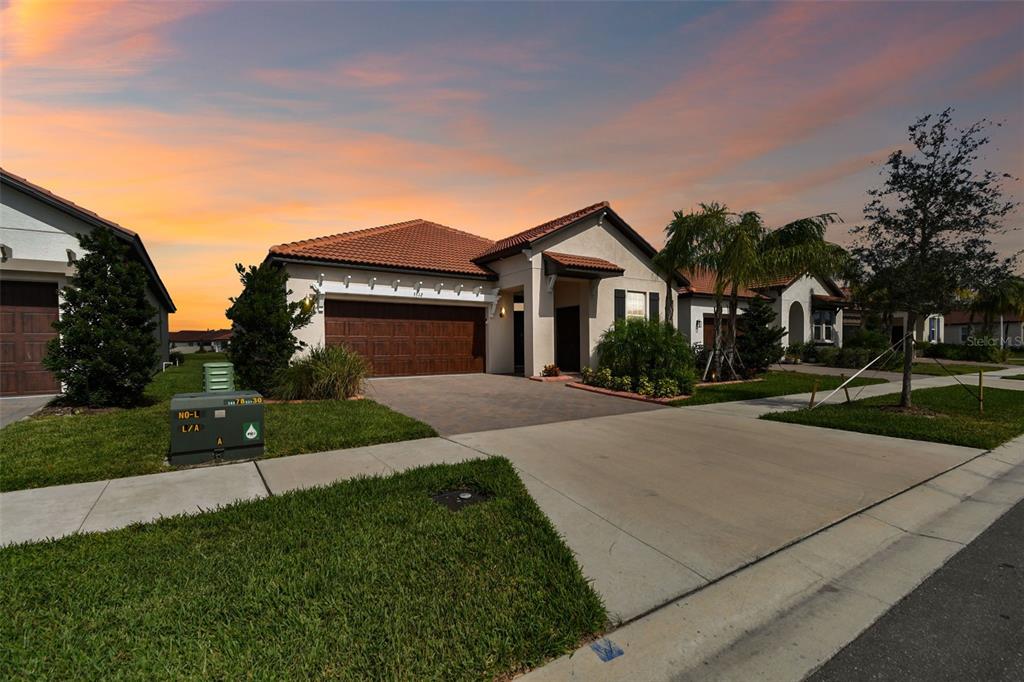 a front view of a house with a yard